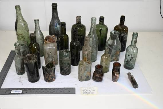 Above, Photo 1: Sample of selection of glass bottles recovered in the first six weeks of excavation. Credit: ODAIT